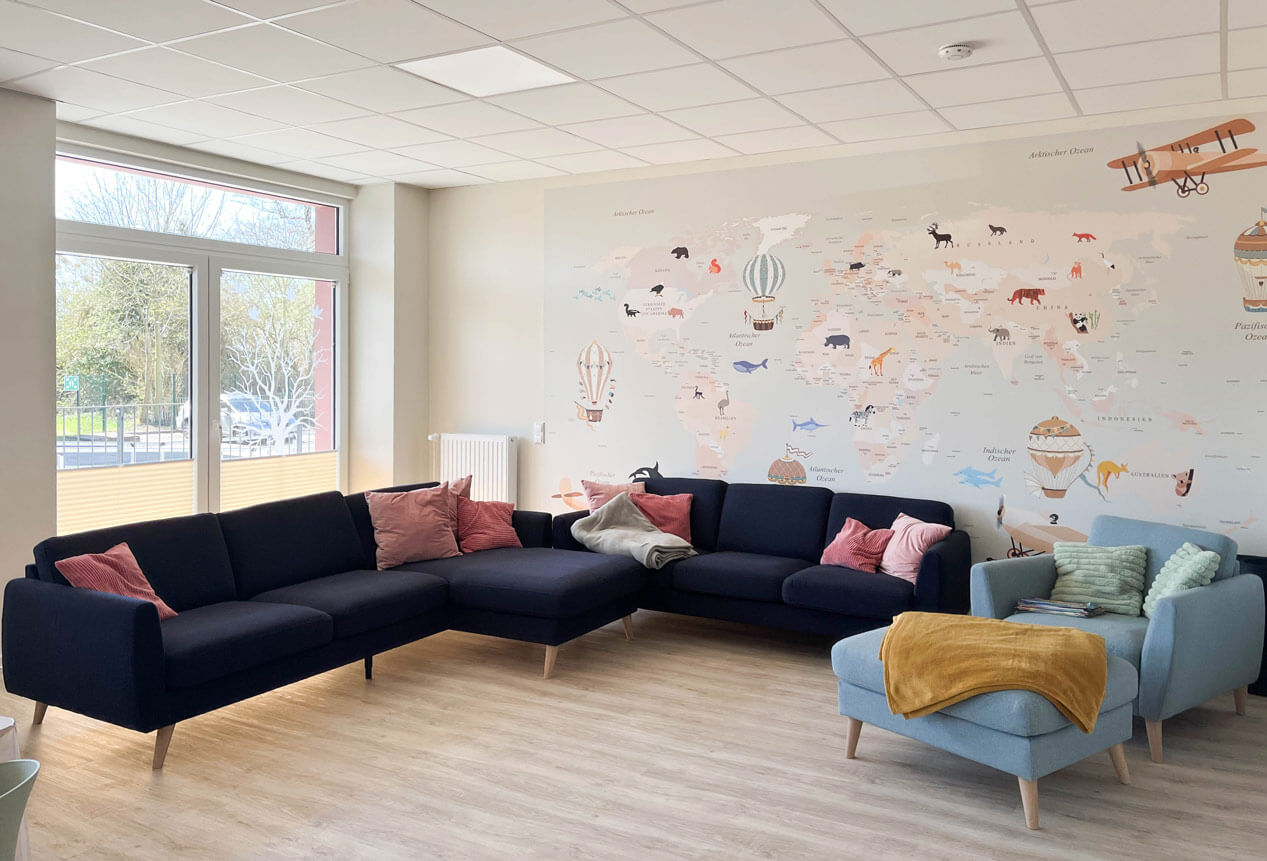 BAHN5-18-Wohnen_cubus-plan Innenansicht des gemeinschaftlichen Wohnzimmers nach dem Umbau.